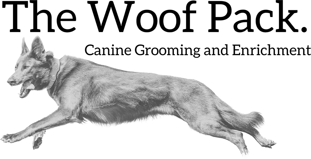 Official logo of The Woof Pack canine grooming studio